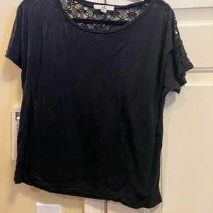 Black YA LA shirt.Black shirt in front. sheer with pattern on back